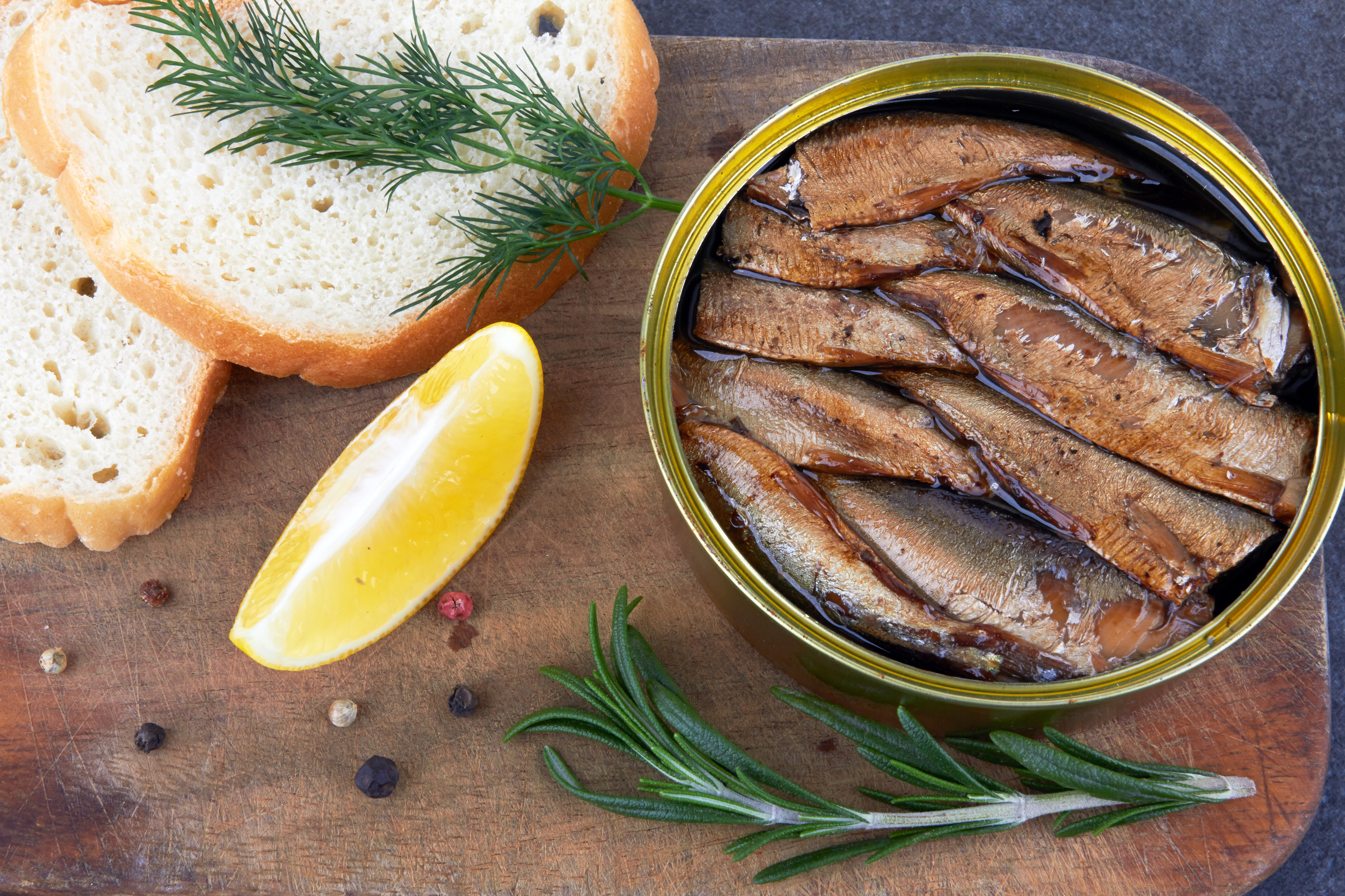 sprats-in-a-tin-can-on-a-wooden-surface-2021-08-30-10-58-42-utc